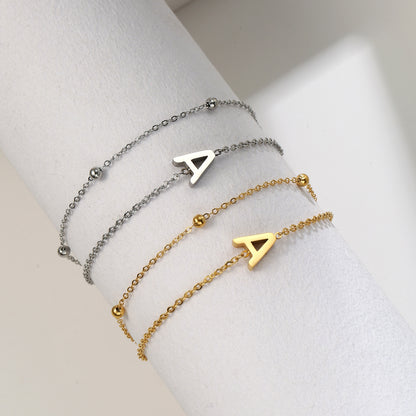 Pulsera con cadena y letras de acero de titanio de doble capa